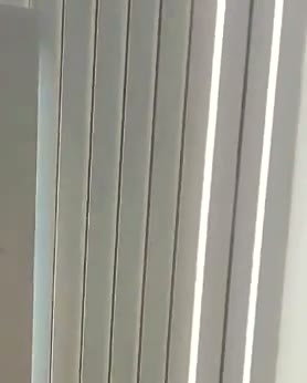 Grey fluted wall with vertical LED strips, Lincoln, built by WK Home Interiors